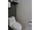 Clean bathroom featuring a standard white toilet and wall mounted toilet paper holder at 1217 Honey Blossom Dr, Orlando, FL 32824
