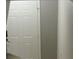 Hallway shot featuring a white door and beige walls at 1217 Honey Blossom Dr, Orlando, FL 32824