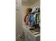 Functional laundry area with washer, dryer, and overhead shelving for ample storage at 1217 Honey Blossom Dr, Orlando, FL 32824