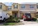 Charming two-story townhouse with attached garage and a well maintained landscaped yard at 1217 Honey Blossom Dr, Orlando, FL 32824