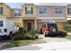 Charming two-story townhouse with attached garage and a well maintained landscaped yard at 1217 Honey Blossom Dr, Orlando, FL 32824