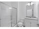 Clean bathroom featuring glass shower, toilet, and vanity sink at 10287 Ebb Tide Lane, Orlando, FL 32821