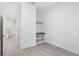 Walk-in closet in a bedroom with tiled floors and a neutral wall color at 10287 Ebb Tide Lane, Orlando, FL 32821