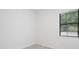 Simple bedroom with a window and tile flooring at 10287 Ebb Tide Lane, Orlando, FL 32821