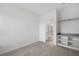 Empty bedroom with a walk-in closet and a glimpse of an adjacent bathroom, showcasing the open layout at 10287 Ebb Tide Lane, Orlando, FL 32821
