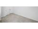Neutral bedroom space with tile flooring and access to a walk-in closet at 10287 Ebb Tide Lane, Orlando, FL 32821