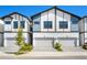 Modern townhome exterior with neutral paint, updated roofing, and private driveways at 10287 Ebb Tide Lane, Orlando, FL 32821