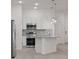 Eat-in kitchen featuring stainless steel appliances and modern lighting at 10287 Ebb Tide Lane, Orlando, FL 32821