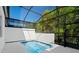 Screened-in pool area with a sparkling in-ground pool and white decking at 10287 Ebb Tide Lane, Orlando, FL 32821
