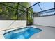Pool with blue trim in a screened enclosure with partial shade at 10287 Ebb Tide Lane, Orlando, FL 32821