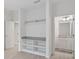 Open walk-in closet design with built-in shelving and access to the bathroom at 10287 Ebb Tide Lane, Orlando, FL 32821
