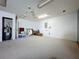 A large basement space with carpet, featuring storage and utility access at 129 Pine Lake View Dr, Davenport, FL 33837
