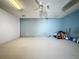 Spacious basement area with carpet flooring, neutral color walls, and a ceiling fan at 129 Pine Lake View Dr, Davenport, FL 33837