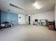 A spacious unfinished basement with carpet, ready to be customized and transformed into a functional living space at 129 Pine Lake View Dr, Davenport, FL 33837