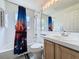 Well-lit bathroom with a shower-tub combo, and vanity sink at 129 Pine Lake View Dr, Davenport, FL 33837