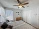 Bedroom with closet, ceiling fan, and window at 129 Pine Lake View Dr, Davenport, FL 33837