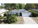 Charming single-story home featuring a well-manicured lawn and an attached two-car garage at 129 Pine Lake View Dr, Davenport, FL 33837