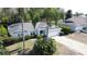 Charming single-story home with well-kept landscaping and a two-car garage in a suburban neighborhood at 129 Pine Lake View Dr, Davenport, FL 33837