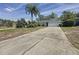 Spacious driveway leading to a well-kept home with a two-car garage at 129 Pine Lake View Dr, Davenport, FL 33837