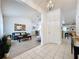 Open-concept living room with modern decor, wood floors, and lots of natural light at 129 Pine Lake View Dr, Davenport, FL 33837