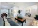 Bright and airy living space with wood floors, modern lighting, and open layout at 129 Pine Lake View Dr, Davenport, FL 33837