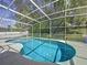 Screened-in pool and clear water; great for outdoor relaxation and Gathering fun, creating your own backyard oasis at 129 Pine Lake View Dr, Davenport, FL 33837