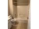 Bathroom featuring a tub with shower, toilet, and vanity at 132 Santana Pl, Davenport, FL 33897