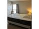 Comfortable bedroom with a large bed, neutral decor, and a window for natural light at 132 Santana Pl, Davenport, FL 33897