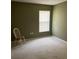 Inviting bedroom with neutral walls, plush carpeting, and a window with blinds at 132 Santana Pl, Davenport, FL 33897