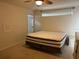 Spacious bedroom featuring a large bed, ceiling fan and natural light from the window at 132 Santana Pl, Davenport, FL 33897