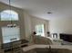 Bright and airy living room with an arch window, dining area and comfortable furniture at 132 Santana Pl, Davenport, FL 33897