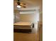 The spacious main bedroom features a comfortable mattress and a ceiling fan at 132 Santana Pl, Davenport, FL 33897