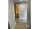 Hallway view to bathroom with decorative tile at 145 Scottsdale Sq # 145, Winter Park, FL 32792