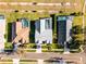 Aerial view of backyard pools, lush landscaping, and driveways from above at 16014 Hawk Hill St, Clermont, FL 34714