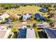 Beautiful home with a two-car garage, surrounded by mature trees and lush landscaping at 16014 Hawk Hill St, Clermont, FL 34714