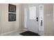 Elegant white front door with decorative glass detailing and sidelights, creating a welcoming entrance at 16014 Hawk Hill St, Clermont, FL 34714