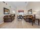 Spacious living room featuring tile flooring, vaulted ceilings, and neutral decor at 16014 Hawk Hill St, Clermont, FL 34714