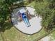 Aerial view of a colorful playground featuring slides and climbing structures for outdoor activities at 16014 Hawk Hill St, Clermont, FL 34714