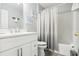 A well lit bathroom featuring a shower, a tub, and a vanity sink at 16035 Wilkinson Dr, Clermont, FL 34714