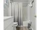 A well lit bathroom featuring a shower, a tub, and a vanity sink at 16035 Wilkinson Dr, Clermont, FL 34714