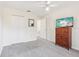 Cozy bedroom features carpet, closet and natural light at 16035 Wilkinson Dr, Clermont, FL 34714