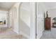 Well-lit hallway featuring an arched alcove, with access to multiple rooms at 16035 Wilkinson Dr, Clermont, FL 34714