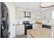 Well-equipped kitchen features stainless steel appliances, granite counters, and ample cabinet space at 16035 Wilkinson Dr, Clermont, FL 34714