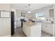 Updated kitchen featuring granite countertops, stainless steel appliances, and a center island at 16035 Wilkinson Dr, Clermont, FL 34714