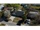Charming home featuring a driveway and yard space, captured from an aerial perspective at 1756 Elbert Acres Ne Ct, Winter Haven, FL 33881