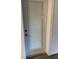 White back door with built-in blinds, combining functionality with a clean, modern look at 1756 Elbert Acres Ne Ct, Winter Haven, FL 33881