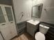 Bathroom featuring vanity, mirror, toilet and cabinet for storage at 1756 Elbert Acres Ne Ct, Winter Haven, FL 33881