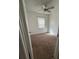 Bedroom with a ceiling fan and a window with blinds at 1756 Elbert Acres Ne Ct, Winter Haven, FL 33881