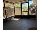 Enclosed sunroom with lattice screens offering shade and privacy, perfect for relaxation at 1756 Elbert Acres Ne Ct, Winter Haven, FL 33881