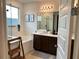 Bright bathroom with a soaking tub, a walk-in shower, and stylish fixtures at 1767 Smarts Rule St, Kissimmee, FL 34744